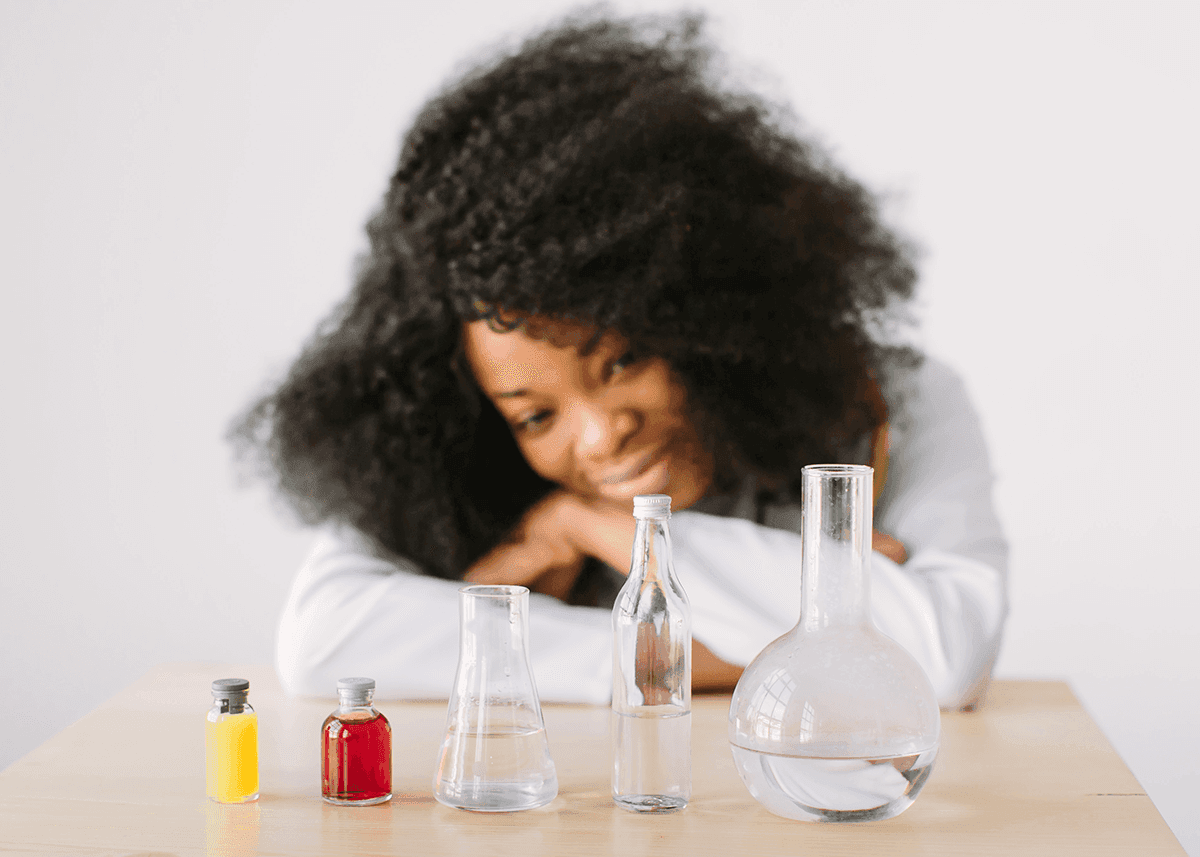 girl looking at essence of perfumery