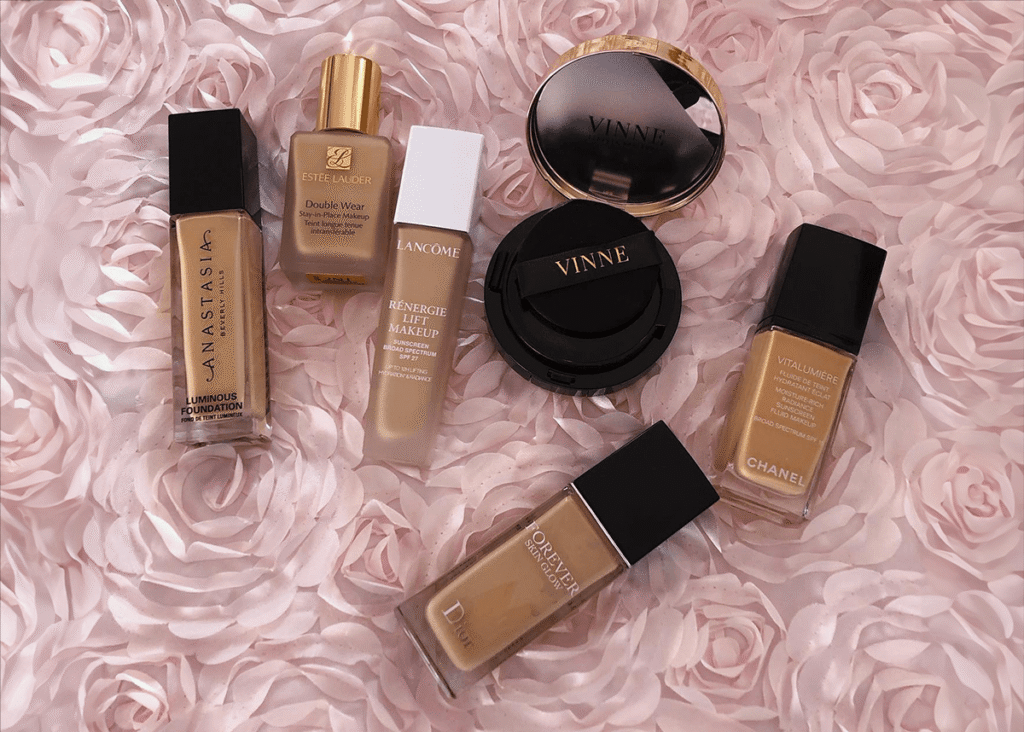 Foundation makeup products on a rose background