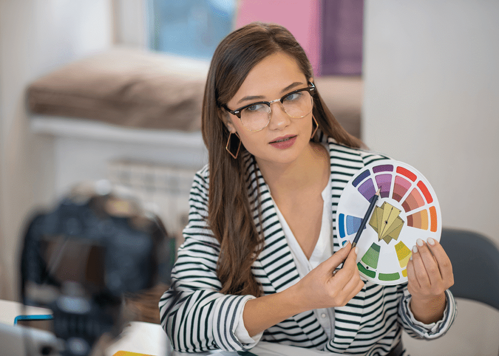 young girl pointing to a colour wheel