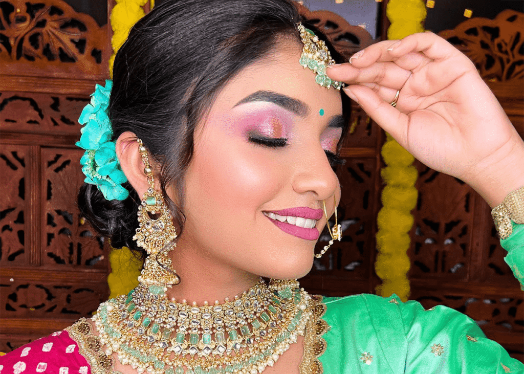 Indian bride shimmering pink orange purple makeup
