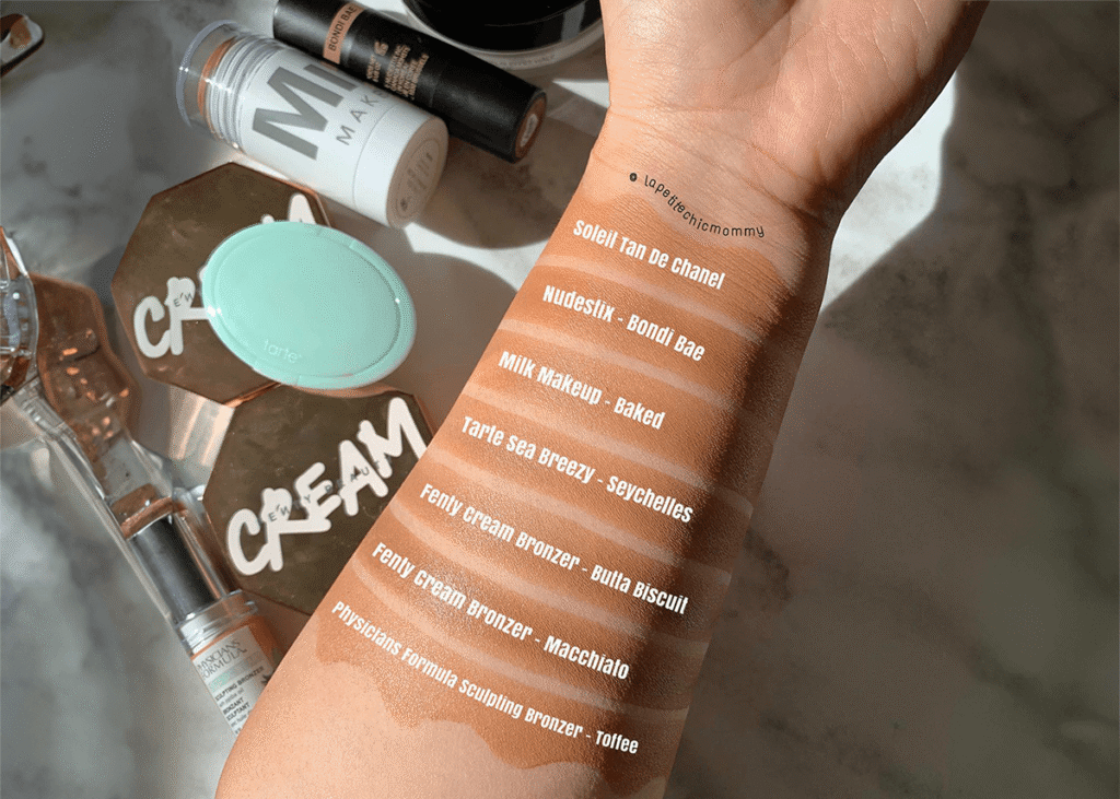 Bronzer applied to arm in swatches with brand text