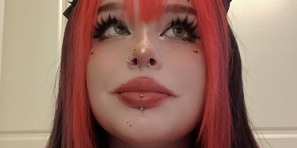Rottenpeachcorpse stamped face with black heart